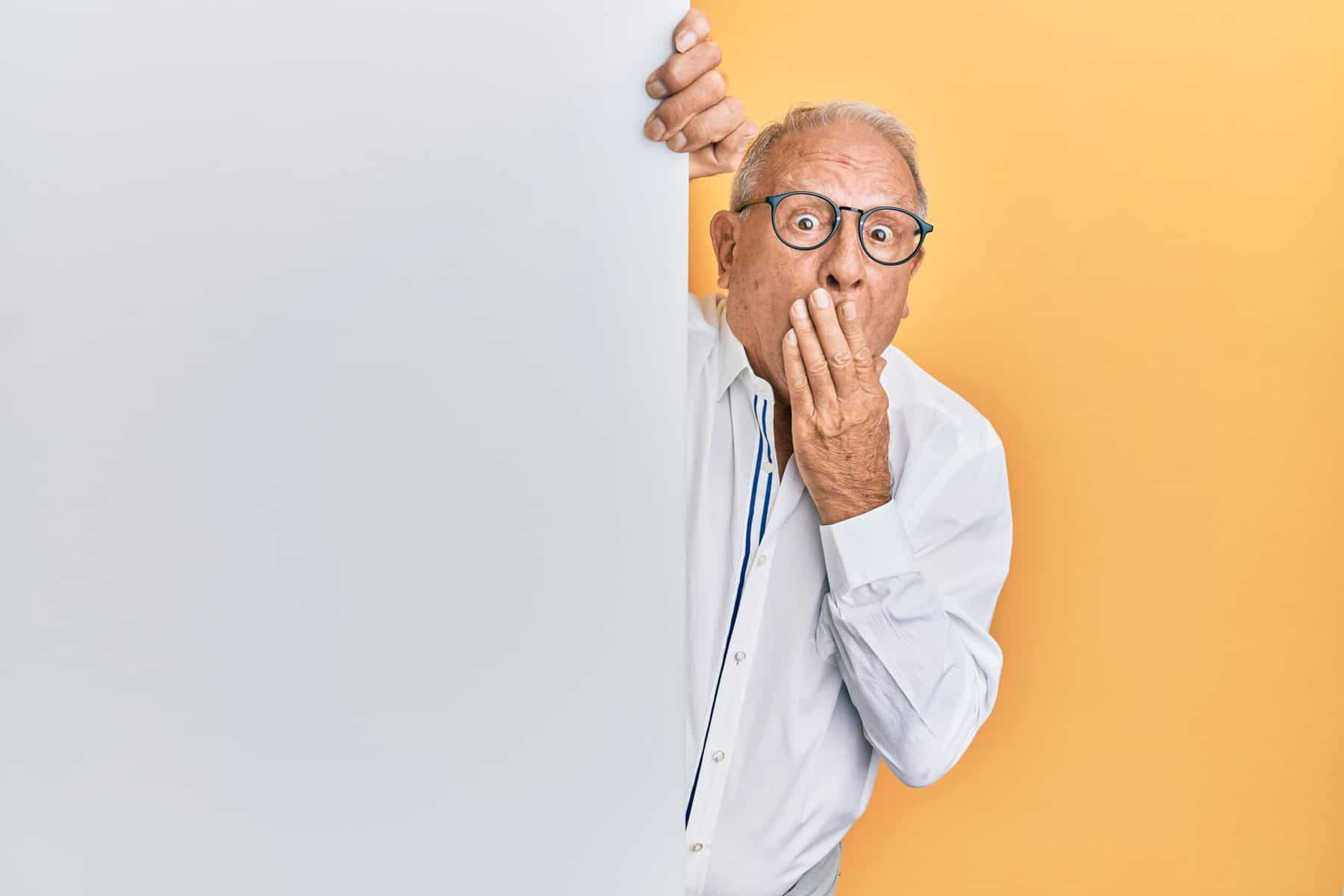 man wearing a white shirt with dark glasses